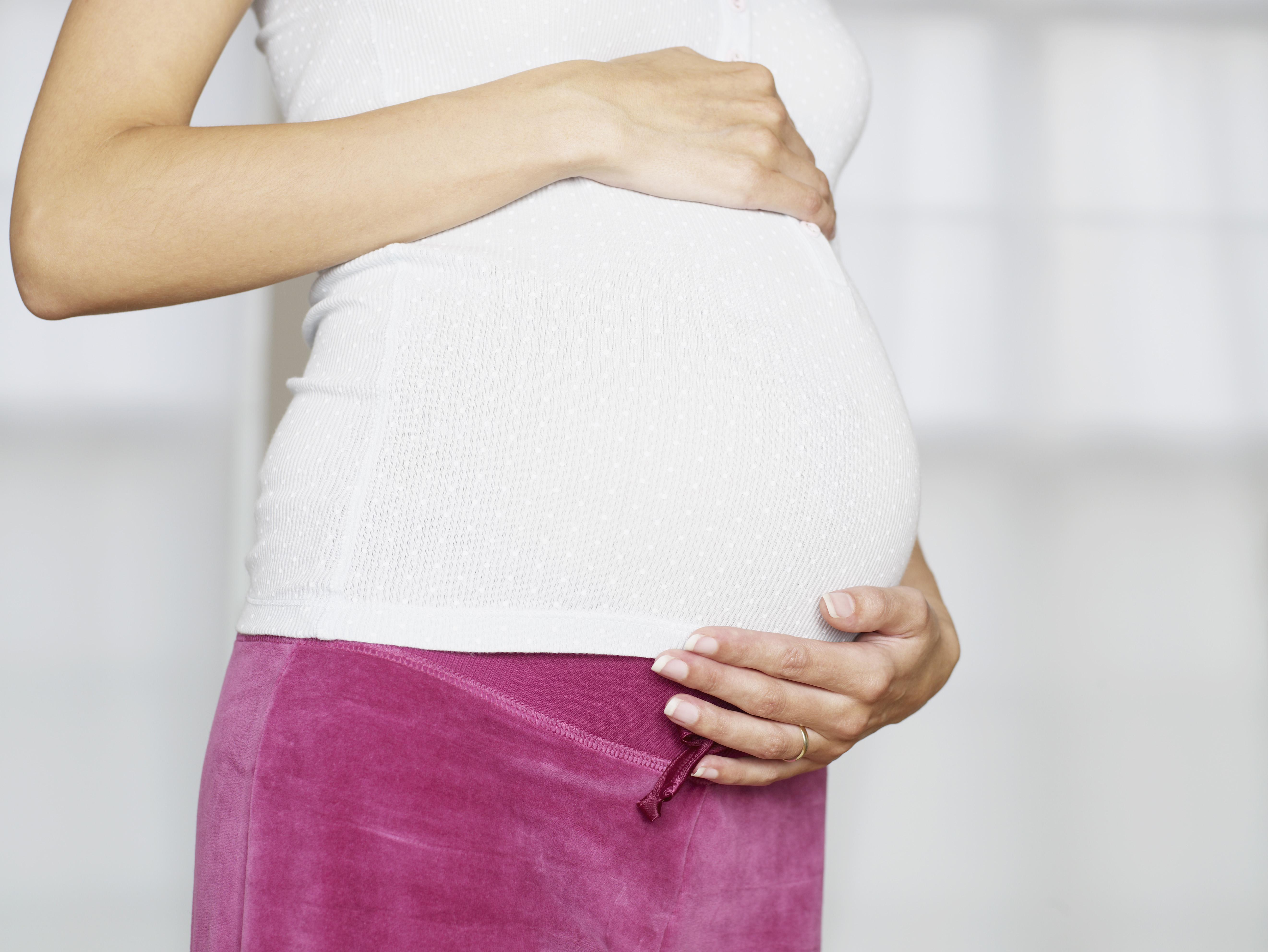 Hands on pregnant belly
