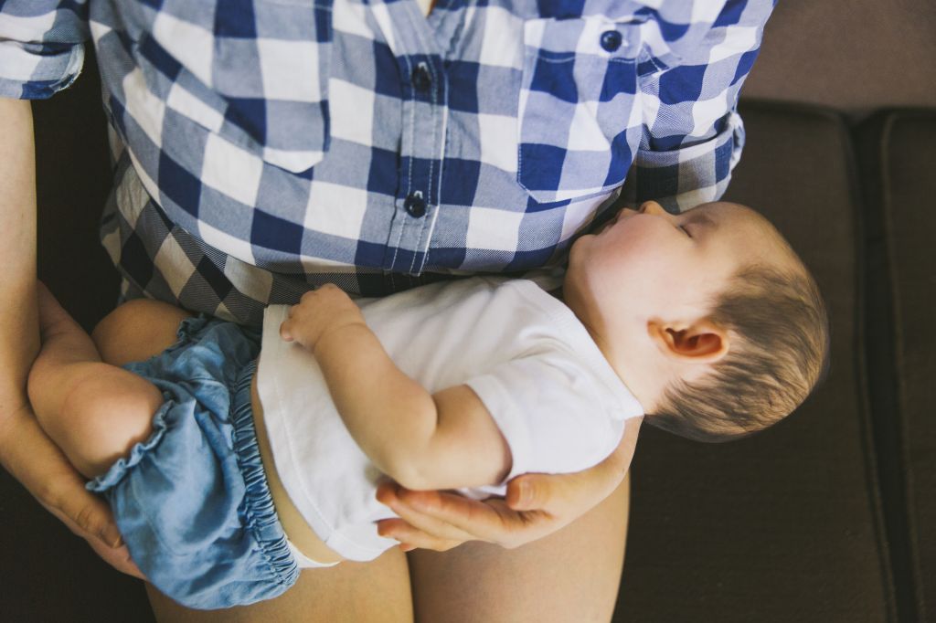 Mother cradling baby