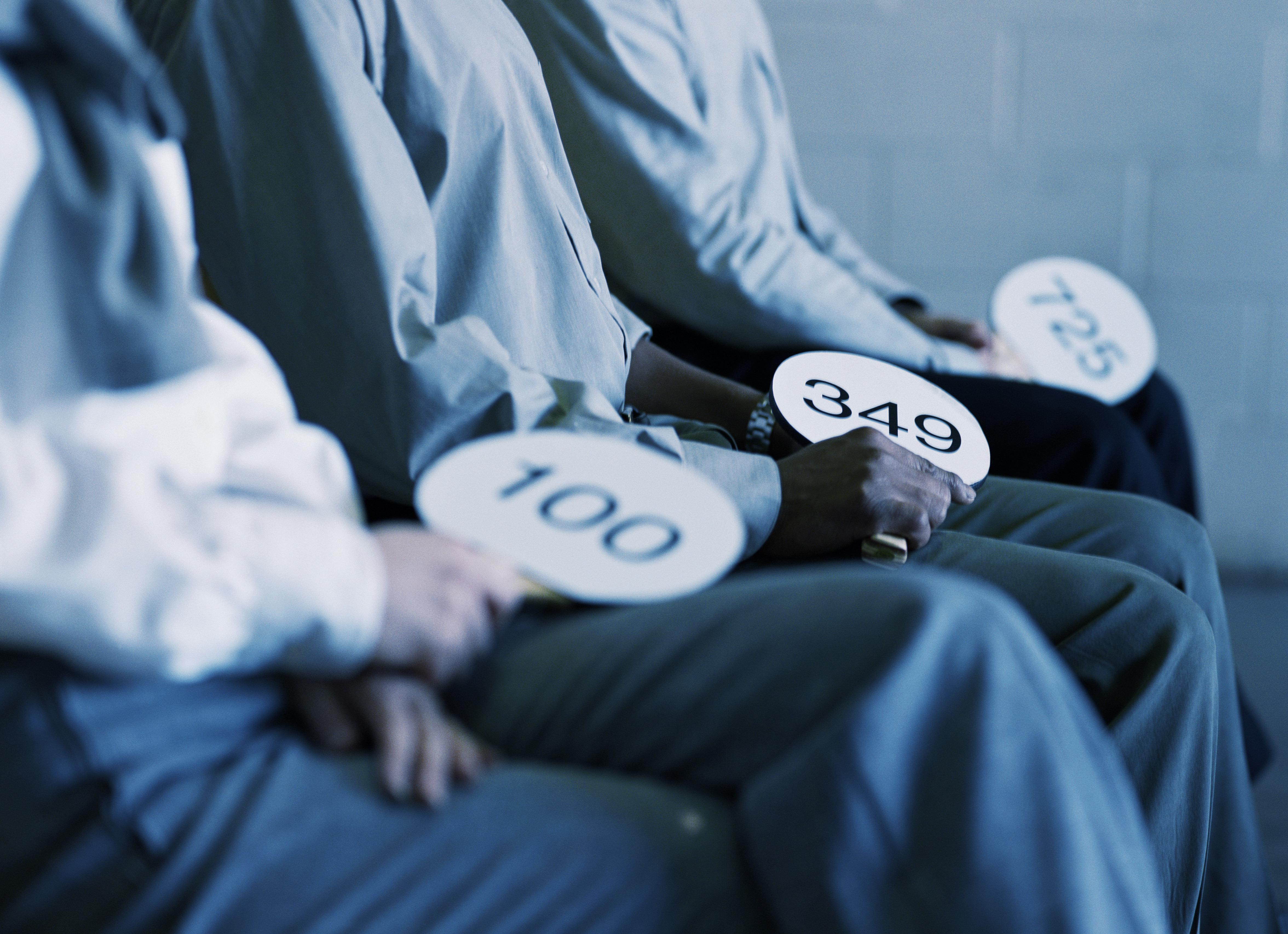 People holding auction paddles