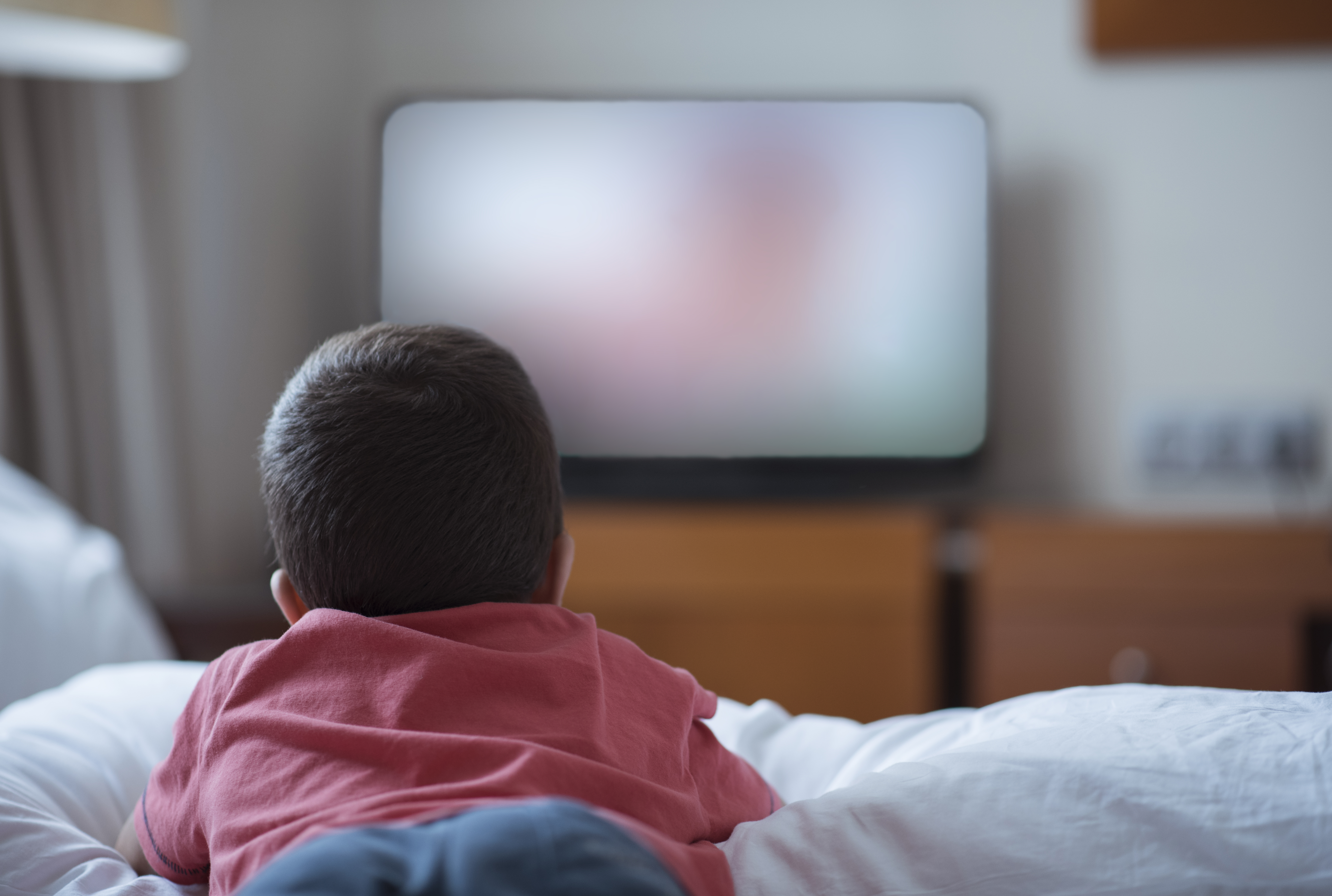 Little boy watching television