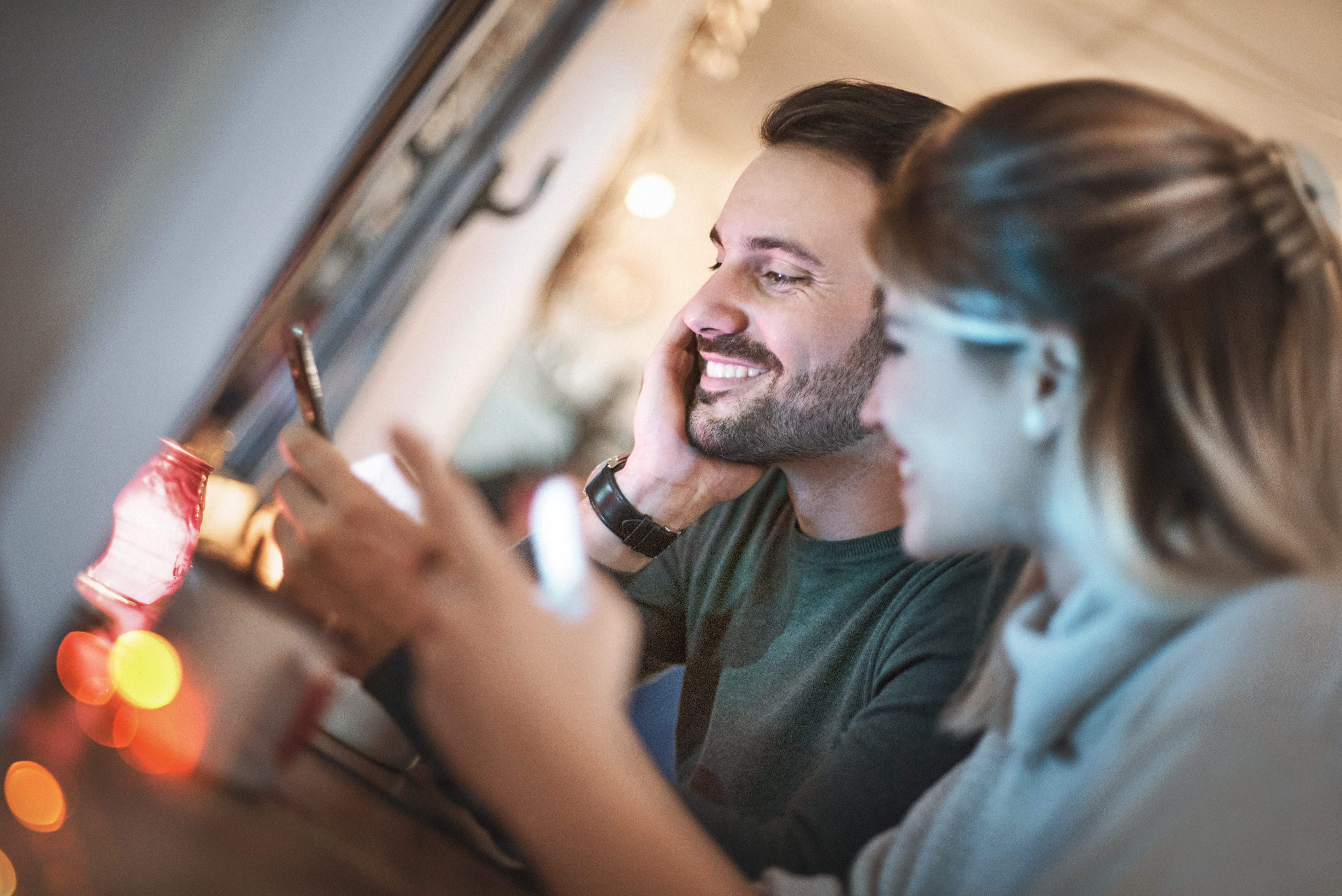 Couple on a date posting on social media.