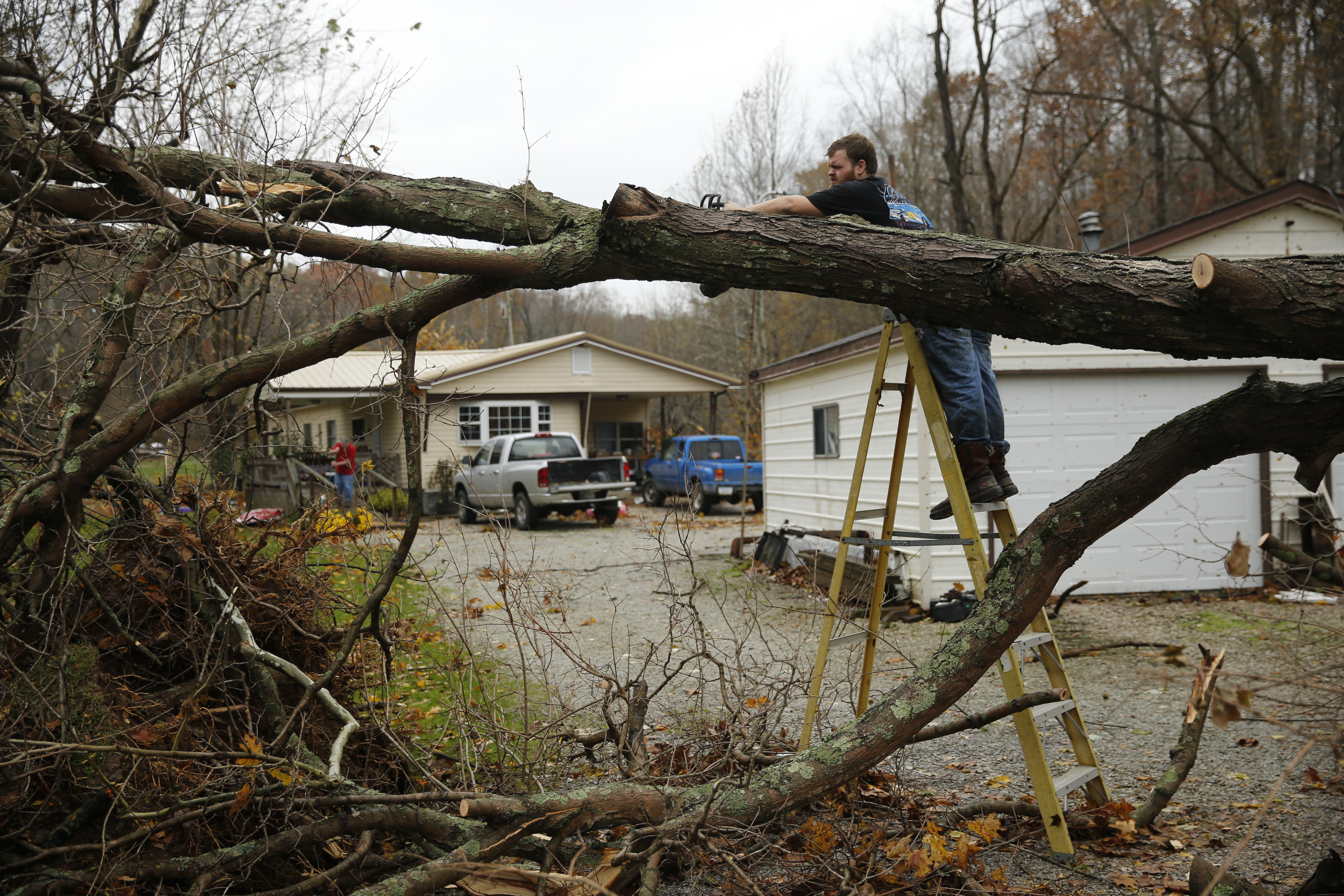 Clearing tornado damage in a driveway