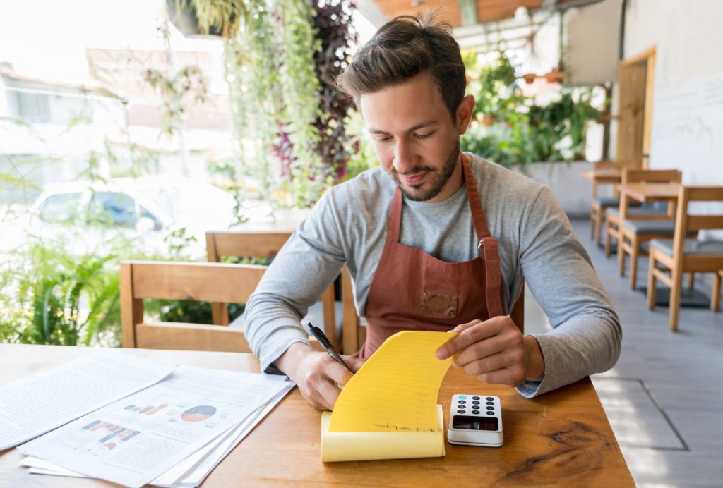 Business owner doing the books at a restaurant
