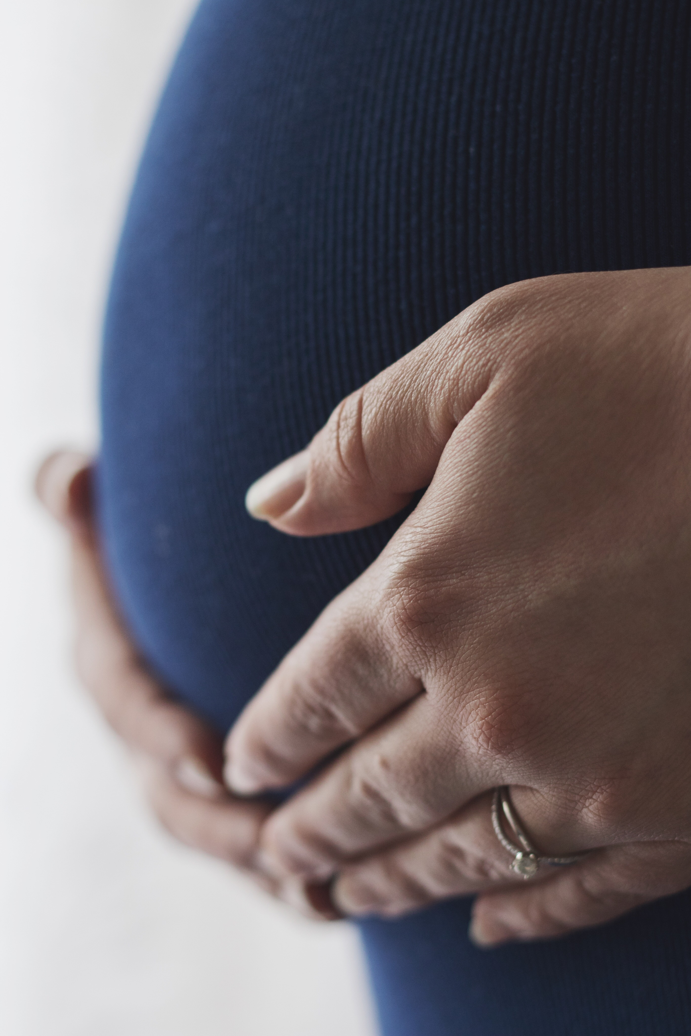 Midsection Of Pregnant Woman Touching Belly