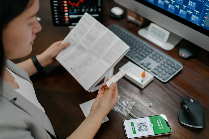 Instant negative Covid-19 test certificate on asian woman smartphone