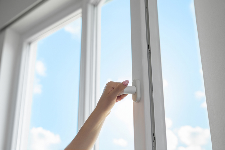 Woman opening window